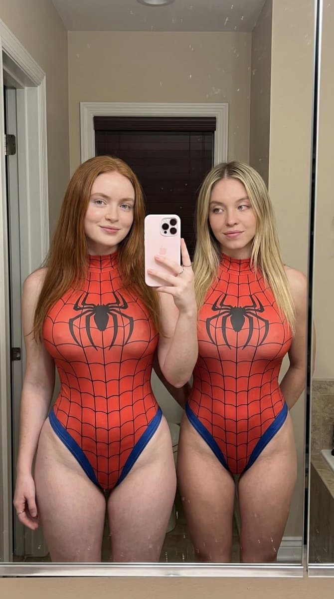 Two Women Mirror Selfie in Superhero Bodysuits