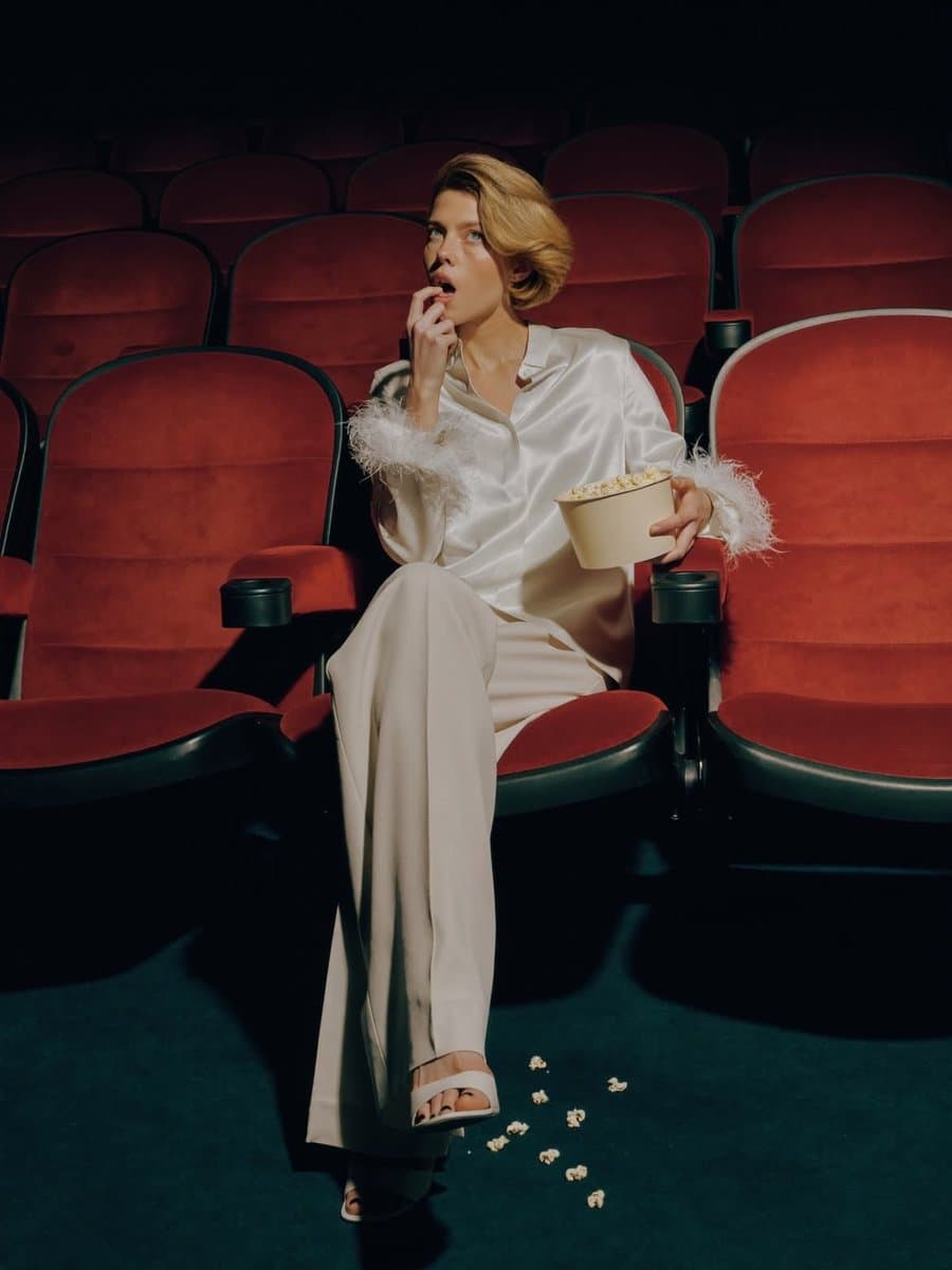 Elegant Fashion Editorial in Dark Movie Theater