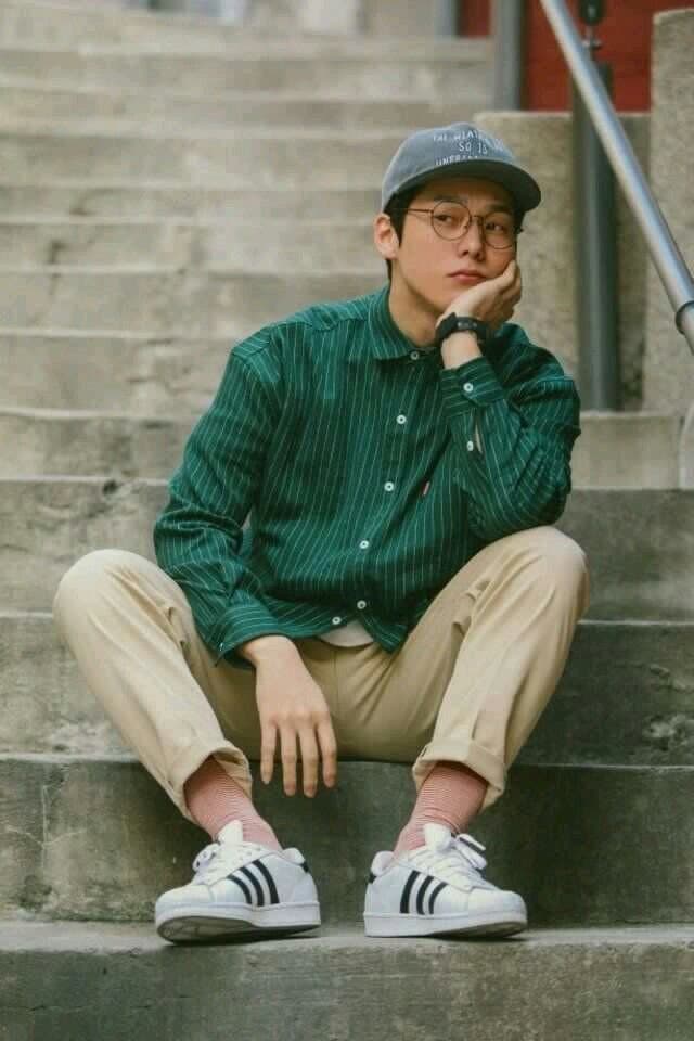 Thoughtful Young Man on Urban Stairs