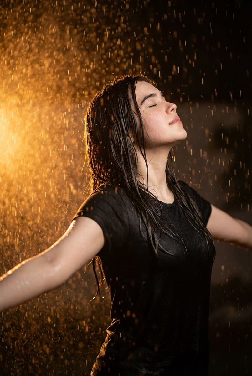 Cinematic Portrait of Woman in Rain with Orange Backlight