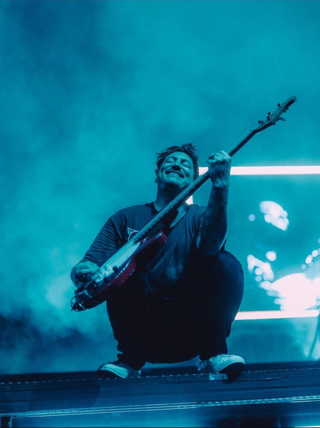 Musician on Stage with Neon Lights and Fog