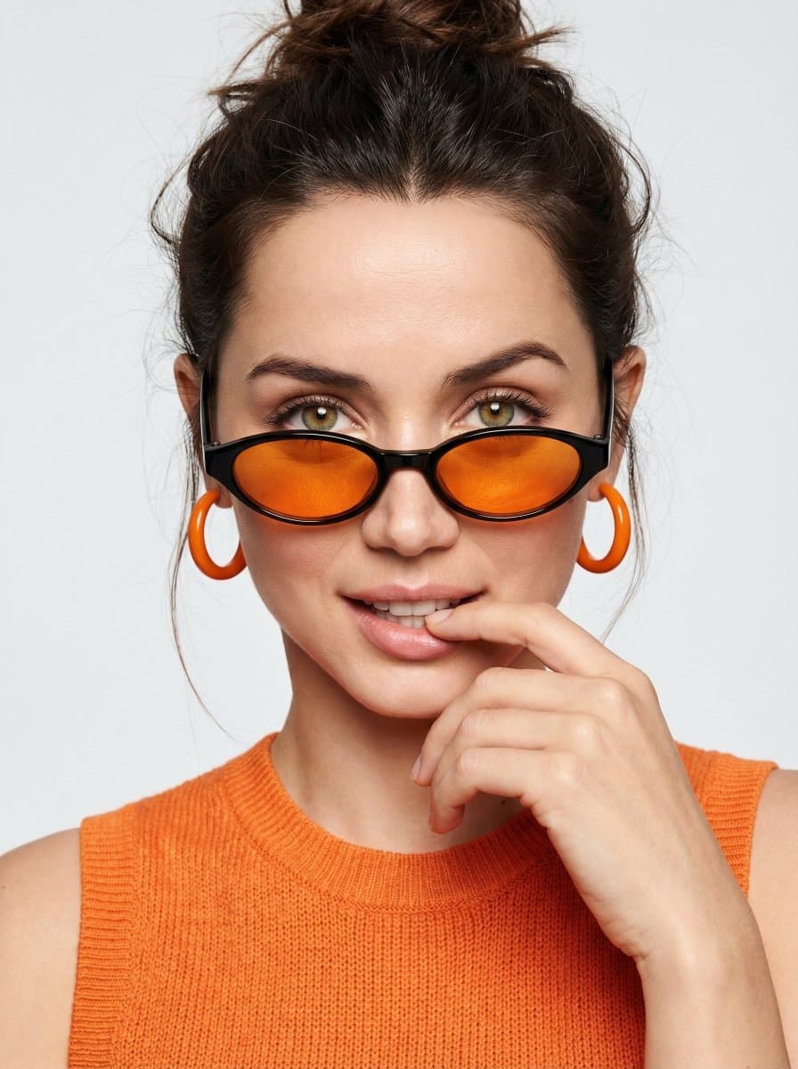 Playful Orange Fashion Portrait with Sunglasses