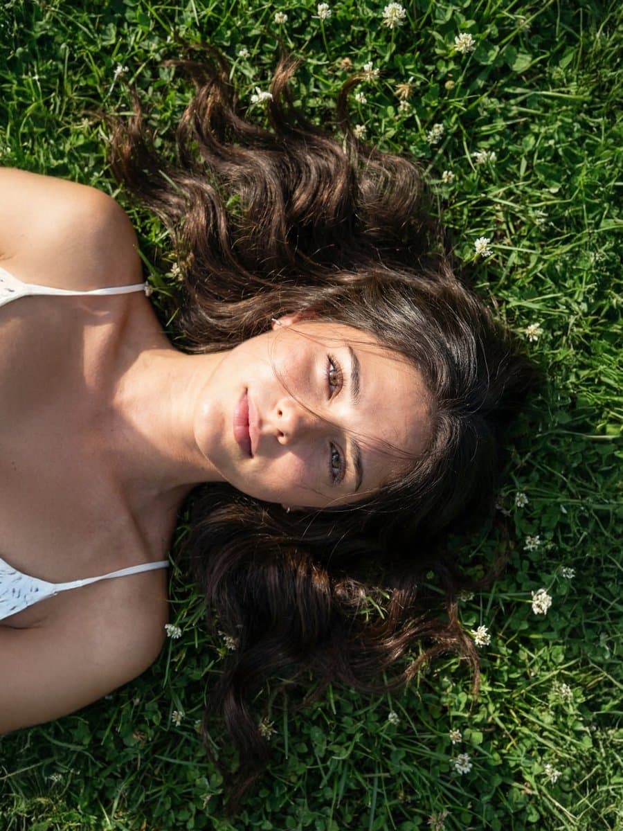 Photorealistic Close-up Portrait on Grass with Sunlight