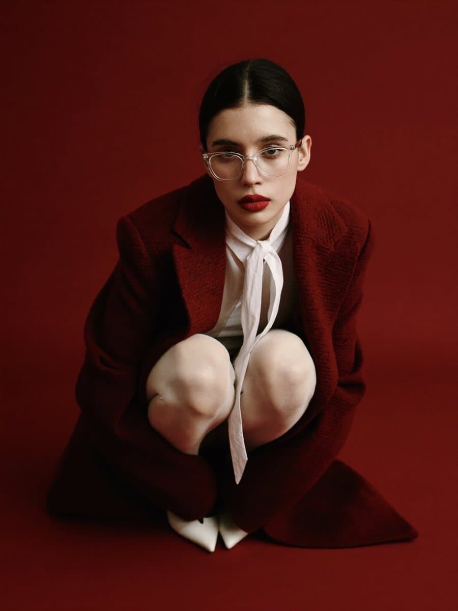 High-Fashion Portrait with Red Coat and Bow Tie